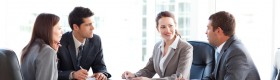 Businessmen and businesswomen talking during a meeting Businessmen and businesswomen talking during a meeting